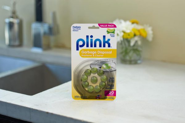 Plink® Garbage Disposal Freshener & Cleaner – Simply Fresh package beside kitchen sink