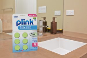 Plink<sup>®</sup> Fizzy Drain Freshener & Cleaner – Simply Fresh package beside bathroom sink