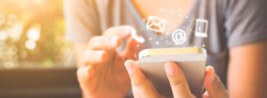 woman typing into smart phone