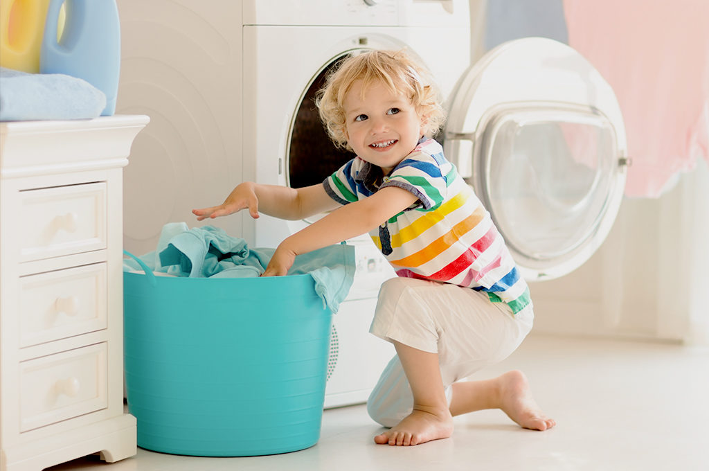 https://summitbrands.com/wp-content/uploads/2019/10/woolite-kid-with-laundry-basket-1024x680.jpg